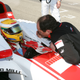 Hamilton in his GP2 cockpit speaking with Vasseur
